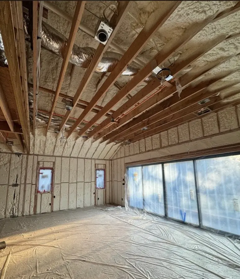 Interior walls and ceiling insulated with spray foam during new construction in Greenville